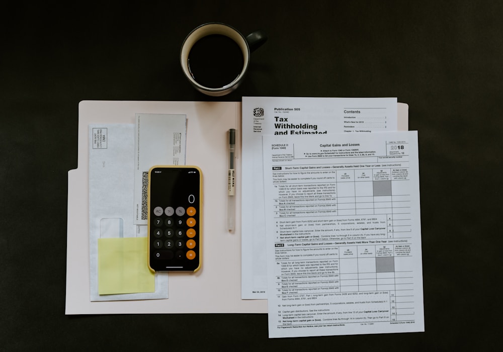 Desk with financial documents and calculator
